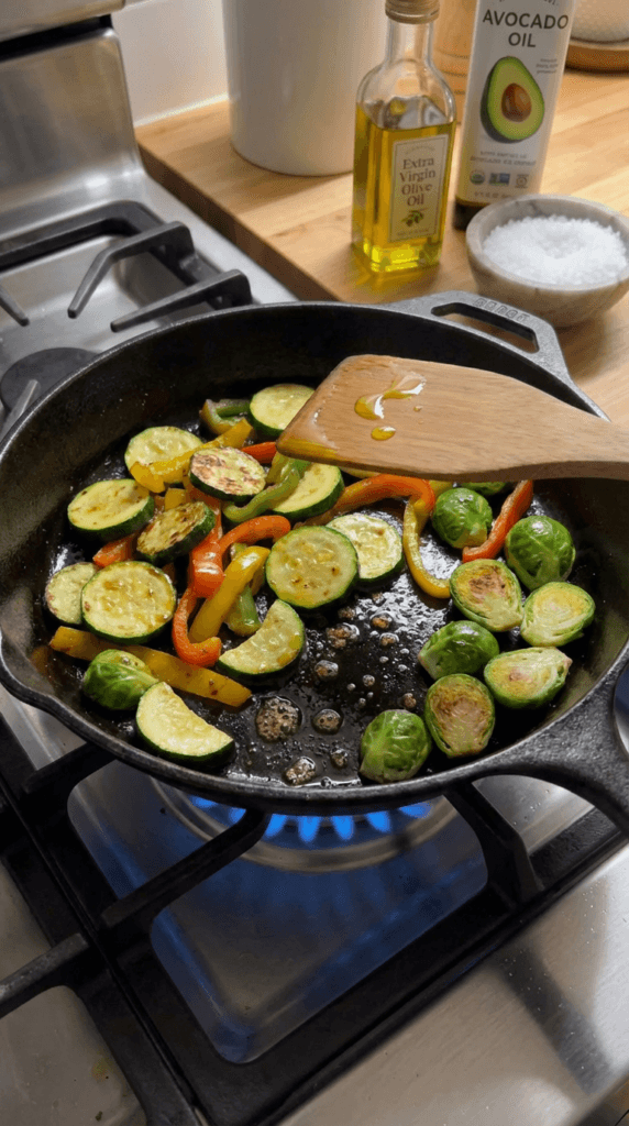 Garden Fresh Sauté: Sizzling cast iron skillet with vibrant veggies, avocado oil, sea salt—ideal for healthy weeknights. Save this idea so you can come back to it later.