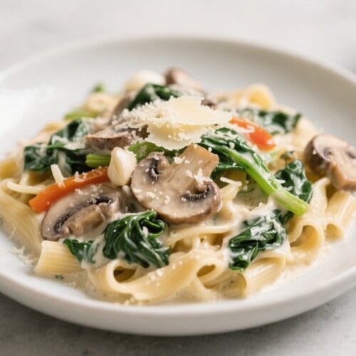 Gourmet Creamy Pasta: Indulgent, fresh noodles with sautéed mushrooms, spinach, peppers & parmesan—ideal for cozy dinners. Save this idea so you can come back to it later.