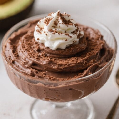 Vegan Chocolate Mousse: Silky, rich mousse in a clear dish with whipped cream and chocolate shavings—indulgent, dairy-free treat perfect for plant-based cravings. Save this idea so you can come back to it later.