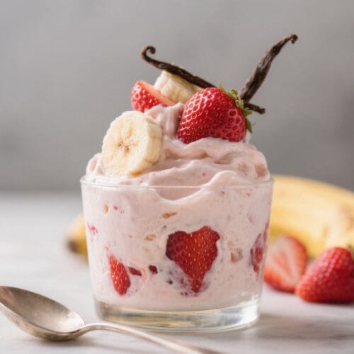 Strawberry-Banana Yogurt Parfait: Lush, chilled treat with fresh slices, shiny spoon—energizing snack. Save this idea so you can come back to it later.