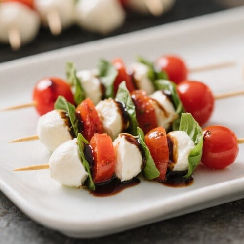 Caprese Skewers for Entertaining: Juicy tomatoes, creamy mozzarella, fresh basil & balsamic. Easy app for gatherings. Save this idea so you can come back to it later.