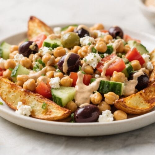 Mediterranean Power Bowl: Vibrant, wholesome plate with crispy potato wedges, juicy veggies, and tangy feta—great for meal prep. Save this idea so you can come back to it later.