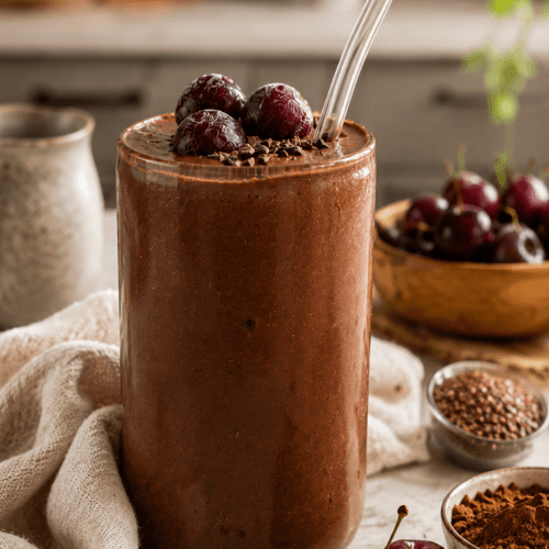 Double Chocolate Cherry Smoothie: Creamy, decadent, refreshing. Topped with frozen cherries & dark shavings—ideal for summer energy. Save this idea so you can come back to it later.
