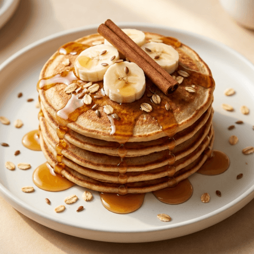 Banana Oat Protein Pancakes: Fluffy, energizing stack glazed with syrup and cinnamon. Great for busy mornings. Save this idea so you can come back to it later.